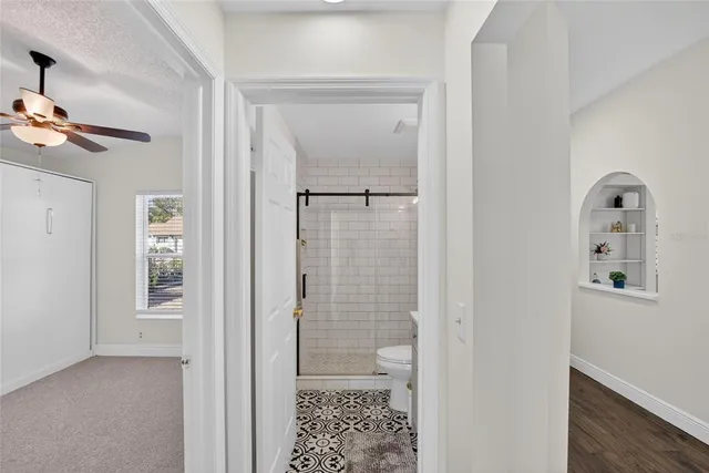 an empty room with ceiling fan