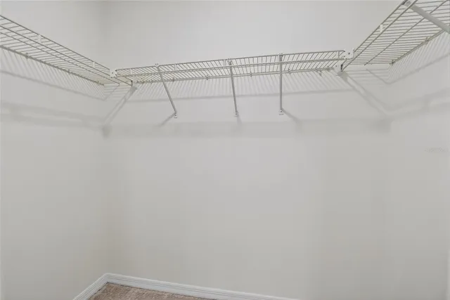 a view of a backyard with chairs