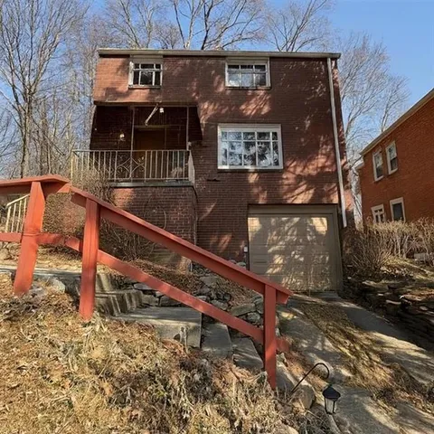 a view of a house with a bench