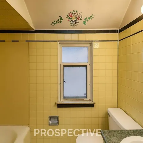 a bathroom with a sink a toilet and mirror