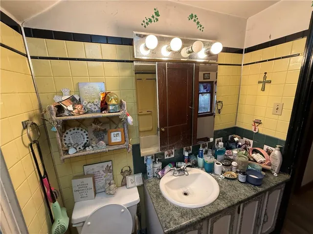 a view of a house with a yard and tree