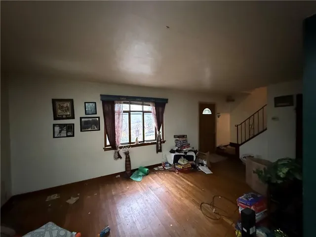 a view of a room with gym equipment and windows