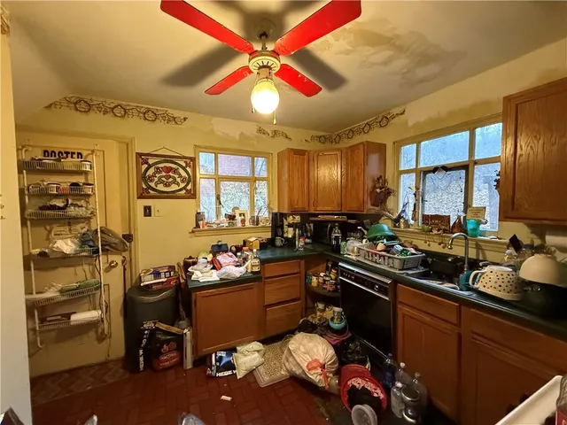 a kitchen with a sink stove and cabinets