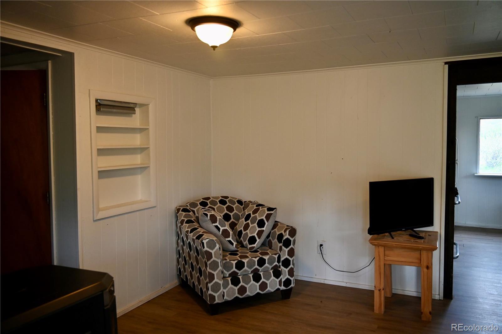 1516 Heeney Road Silverthorne, CO 80498 - Photo 8 of 16 a view of workspace with wooden floor stairs and a window