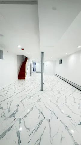 a large white bed in a white room