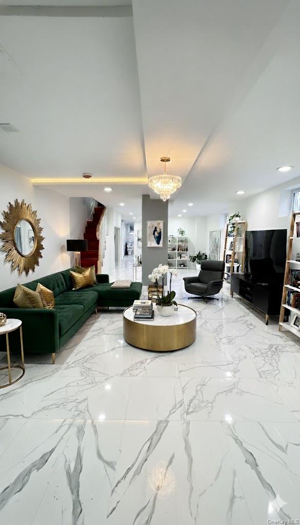 116-45 195th Street Queens, NY 11412 - Photo 20 of 21 a living room with furniture and a flat screen tv