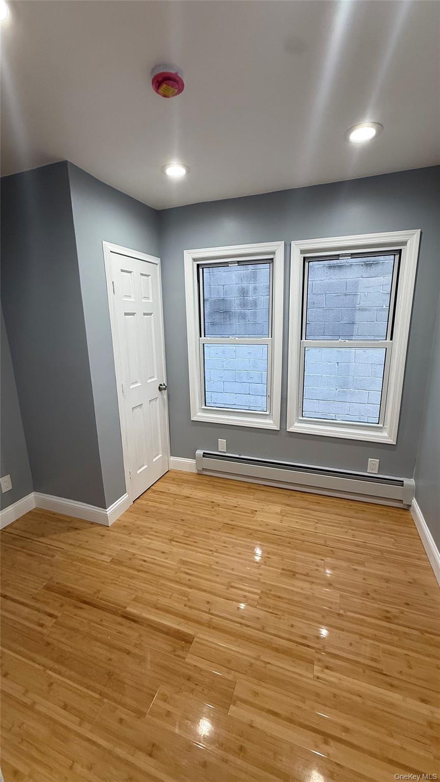 116-45 195th Street Queens, NY 11412 - Photo 4 of 21 a view of an empty room with a window