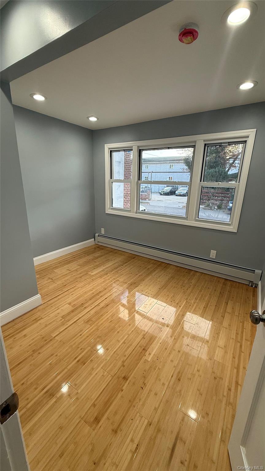 116-45 195th Street Queens, NY 11412 - Photo 8 of 21 a view of an empty room with a window