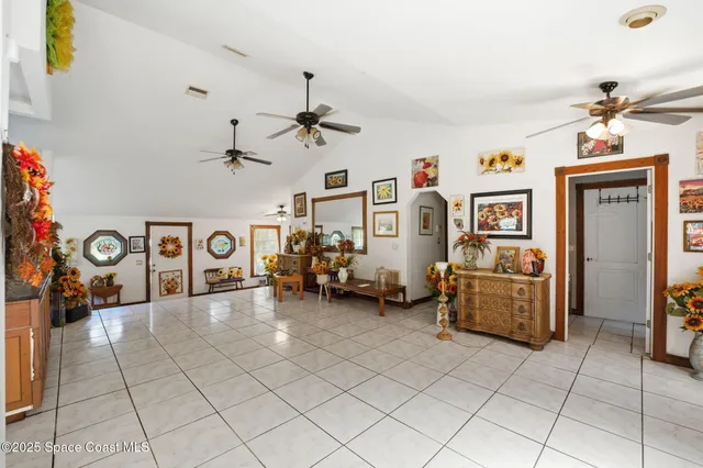 a view of a livingroom with furniture and a window