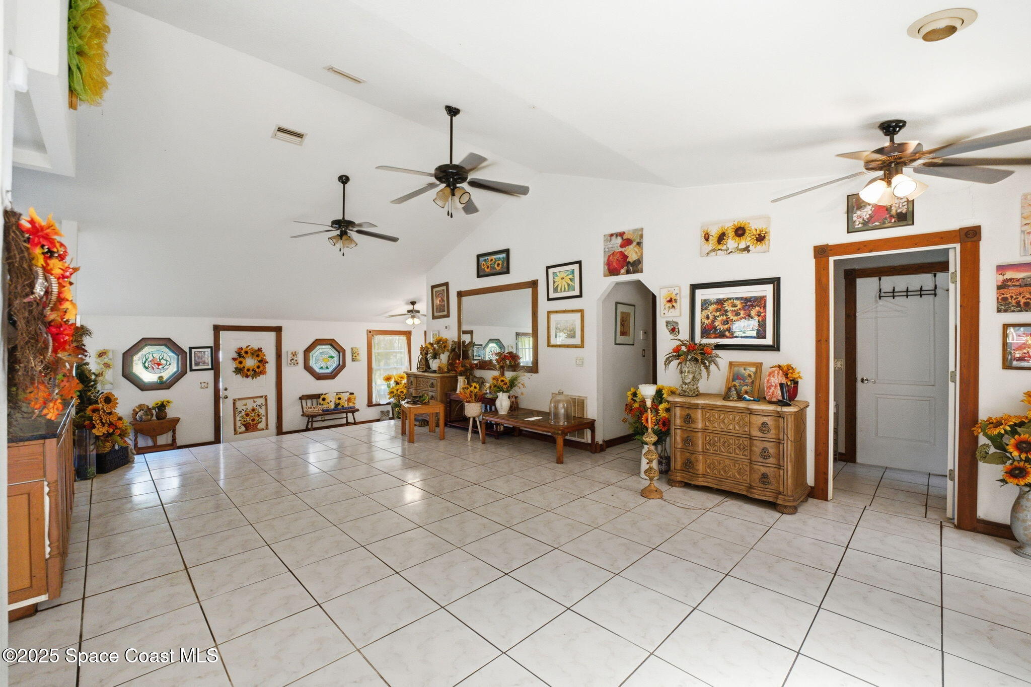 2821-2825 Lionel Road Mims, FL 32754 - Photo 11 of 42 a view of a livingroom with furniture and a window