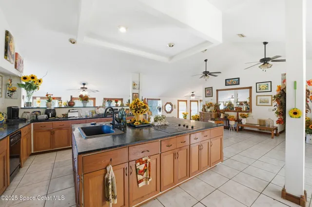 a kitchen with stainless steel appliances granite countertop a sink and cabinets
