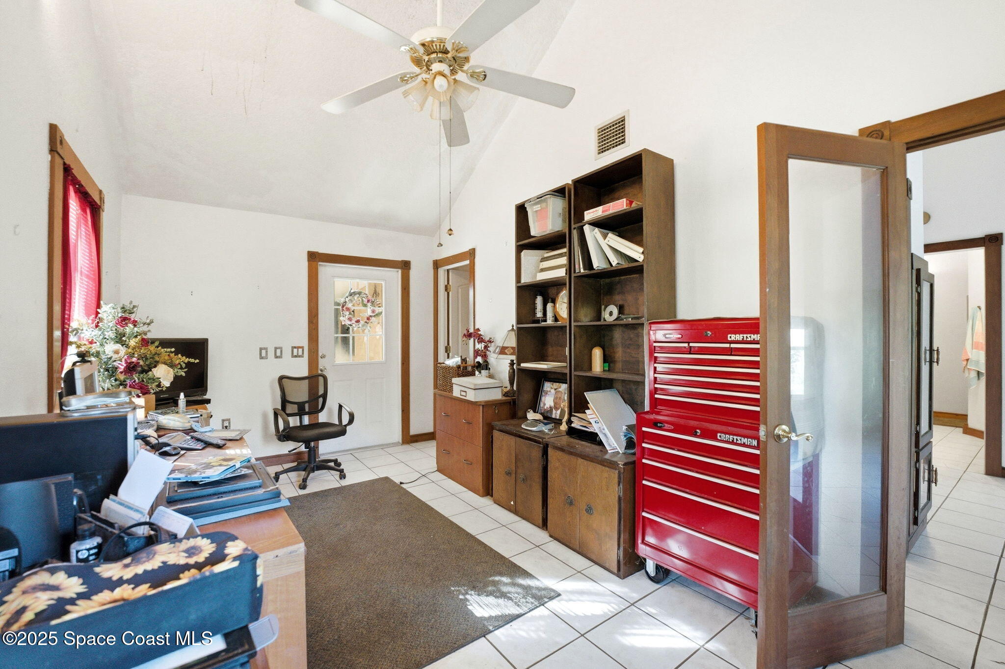 2821-2825 Lionel Road Mims, FL 32754 - Photo 23 of 42 a living room with furniture a rug and a window