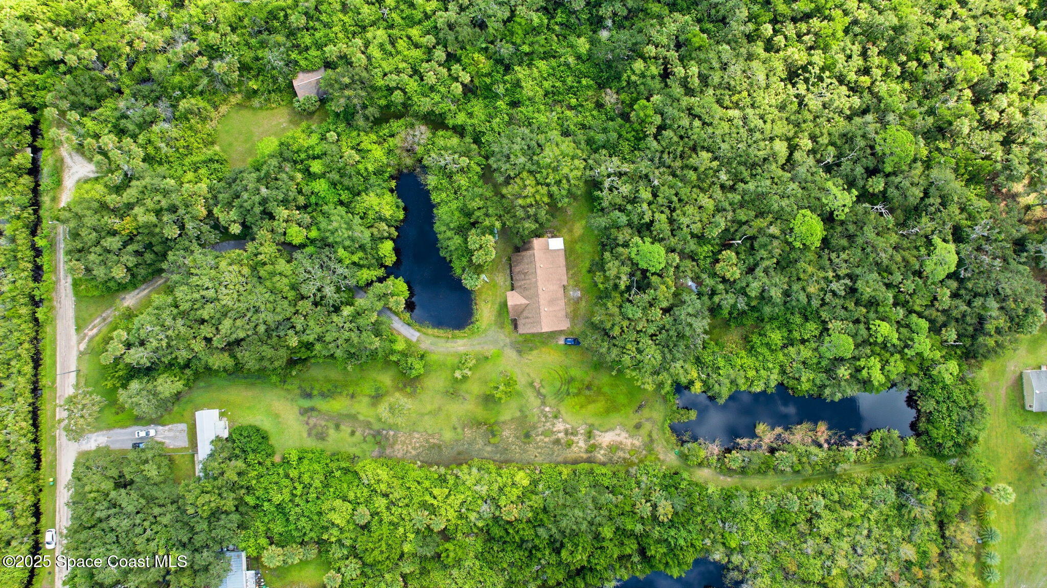 2821-2825 Lionel Road Mims, FL 32754 - Photo 33 of 42 a view of a garden