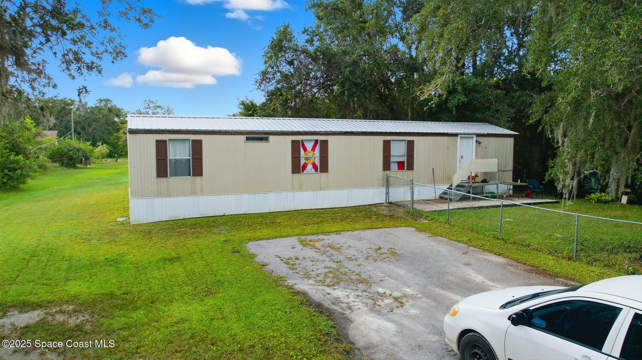 2821-2825 Lionel Road Mims, FL 32754 - Photo 41 of 42 a view of outdoor space yard and patio