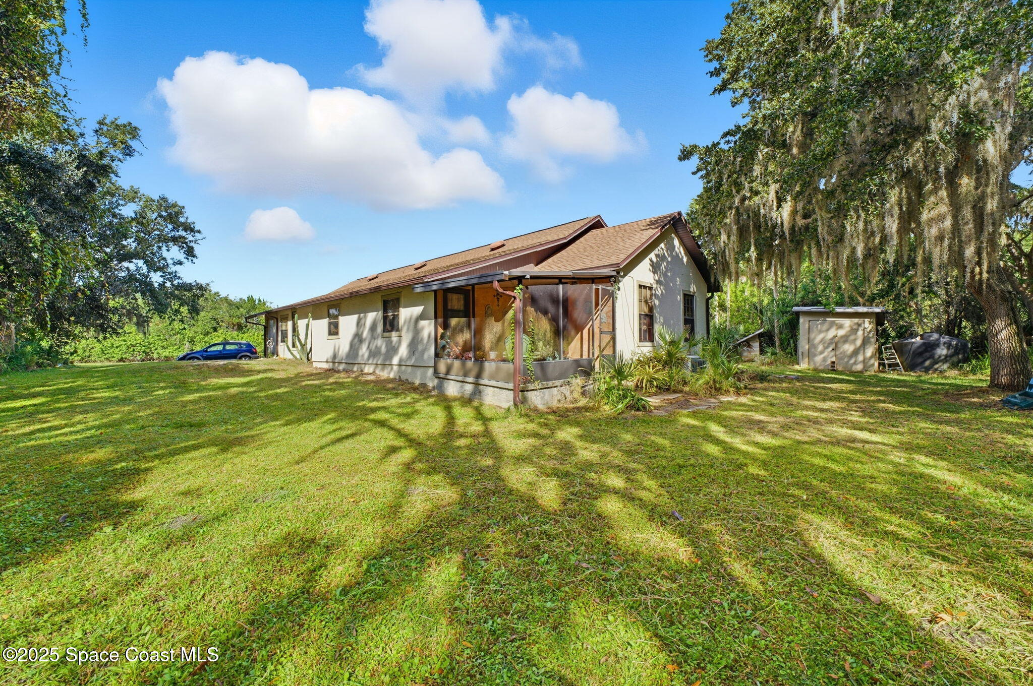 2821-2825 Lionel Road Mims, FL 32754 - Photo 5 of 42 a view of a house with a yard