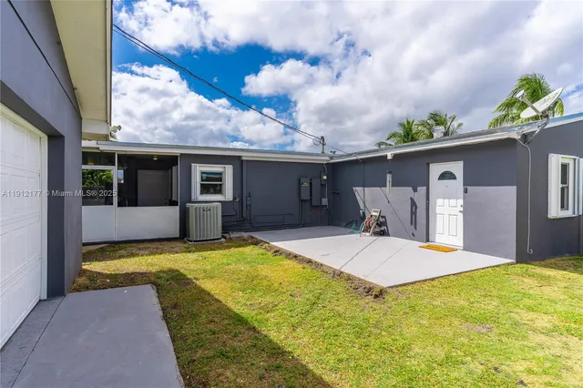 a view of a house with pool and yard