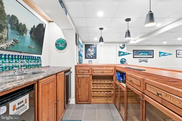 a view of a wooden chairs on the roof deck