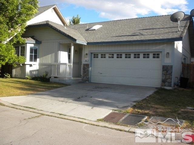 486 Len Circle Reno, NV 89511 - Photo 1 of 7 a front view of a house with a yard and garage