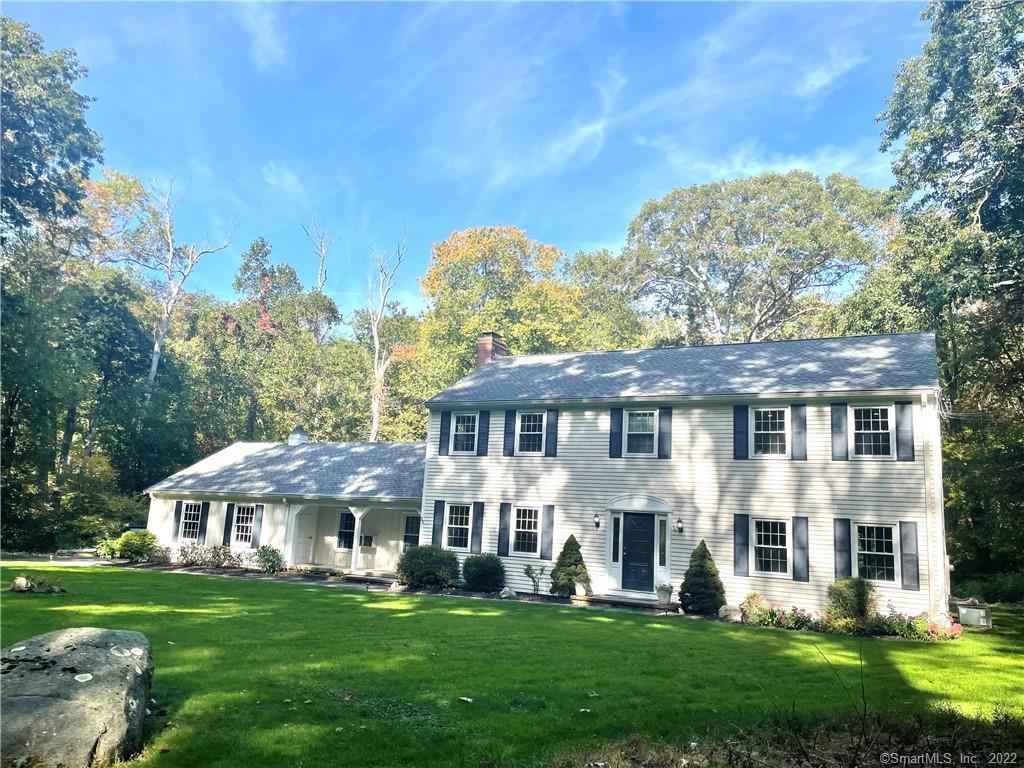 33 Acorn Road Madison, CT 06443 - Photo 1 of 1 a front view of a house with a garden