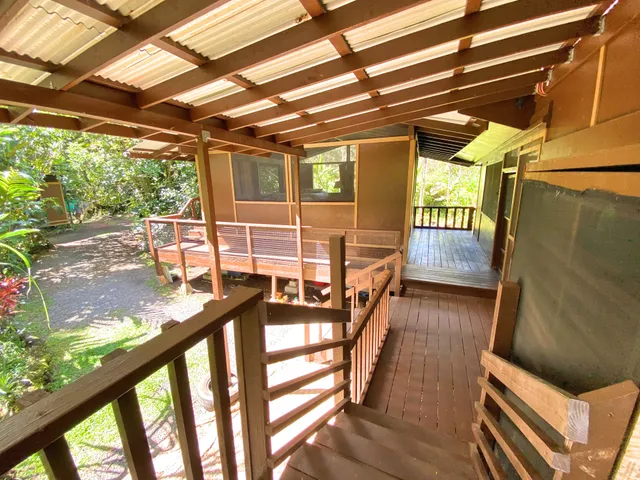 a view of a porch with wooden floor