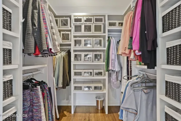 a view of walk in closet with large windows