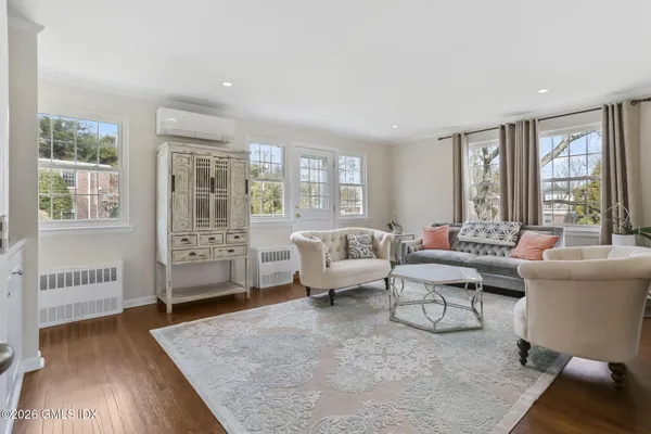 a living room with furniture and a large window