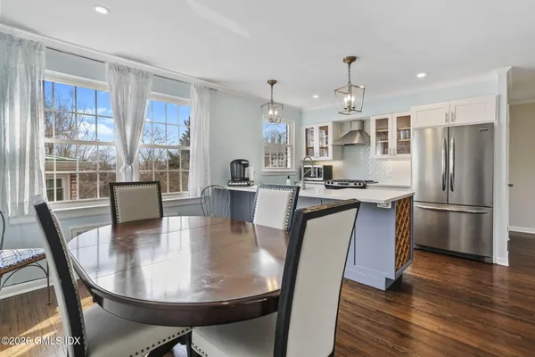 a view of a dining room with furniture window and wooden floor