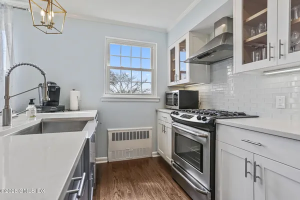 a kitchen with a stove and a sink
