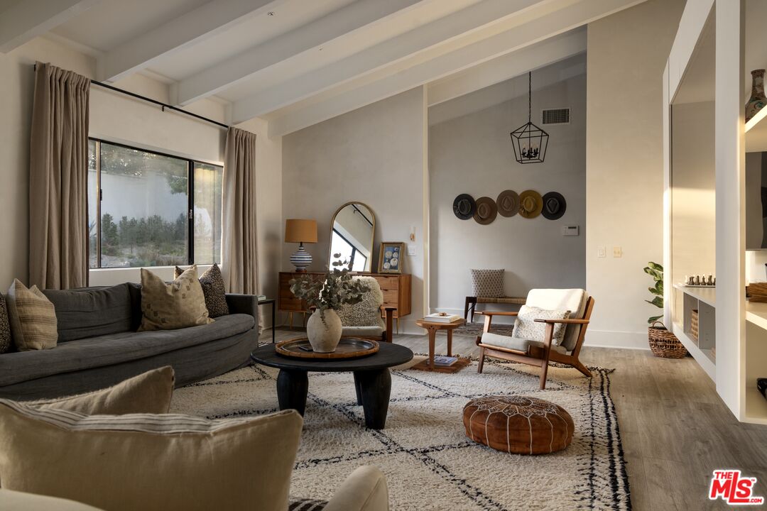29328 Heathercliff Road Malibu, CA 90265 - Photo 1 of 41 a living room with furniture and a large window