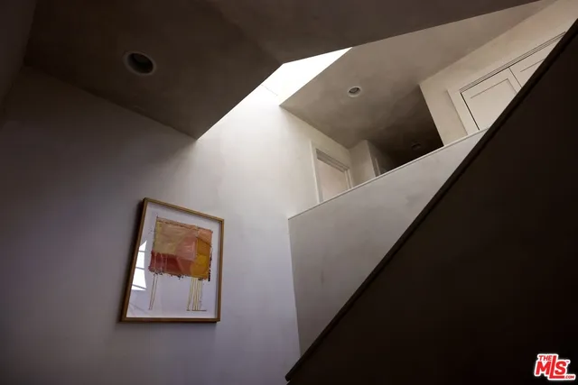 a view of staircase with a flat screen tv