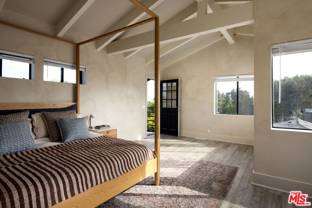 29328 Heathercliff Road Malibu, CA 90265 - Photo 19 of 41 a bedroom with a large bed and a window