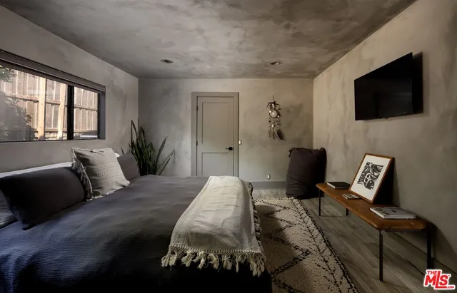 a bathroom with a toilet sink double vanity and mirror