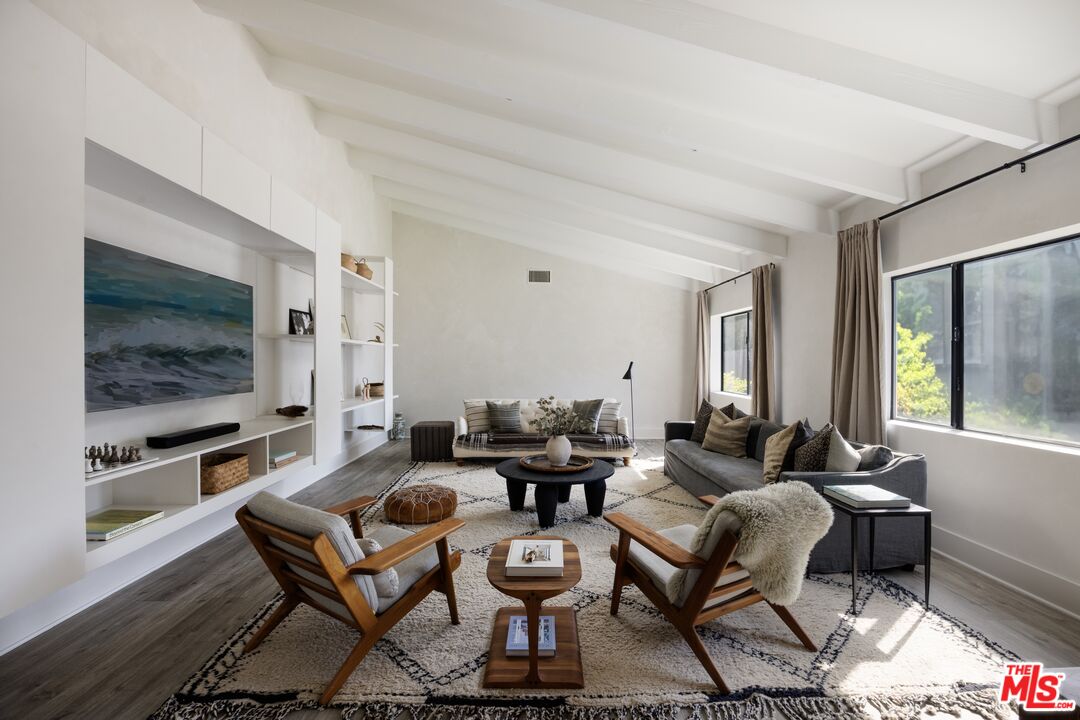 29328 Heathercliff Road Malibu, CA 90265 - Photo 7 of 41 a living room with fireplace furniture and a flat screen tv