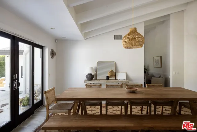 a view of a dining room with furniture and window