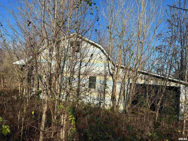 a view of building with large trees