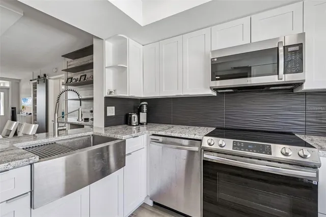 a kitchen with a table and chairs in it