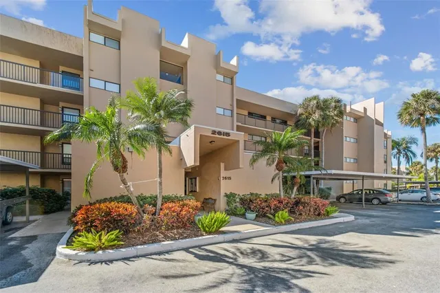a view of a patio with plants and table