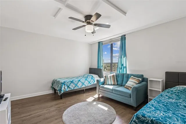 a view of a dining area with furniture wooden floor and chandelier