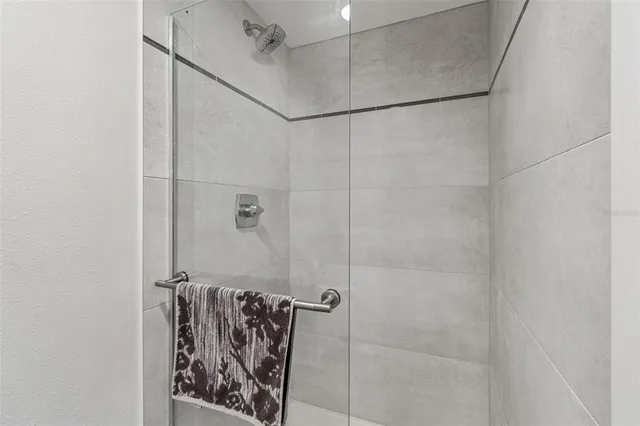 a living room with furniture a table and a pool table