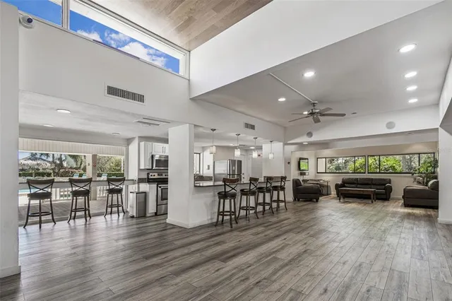 a view of a swimming pool with a table and chairs