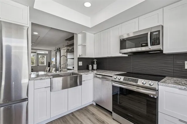 a view of front door with wooden floor