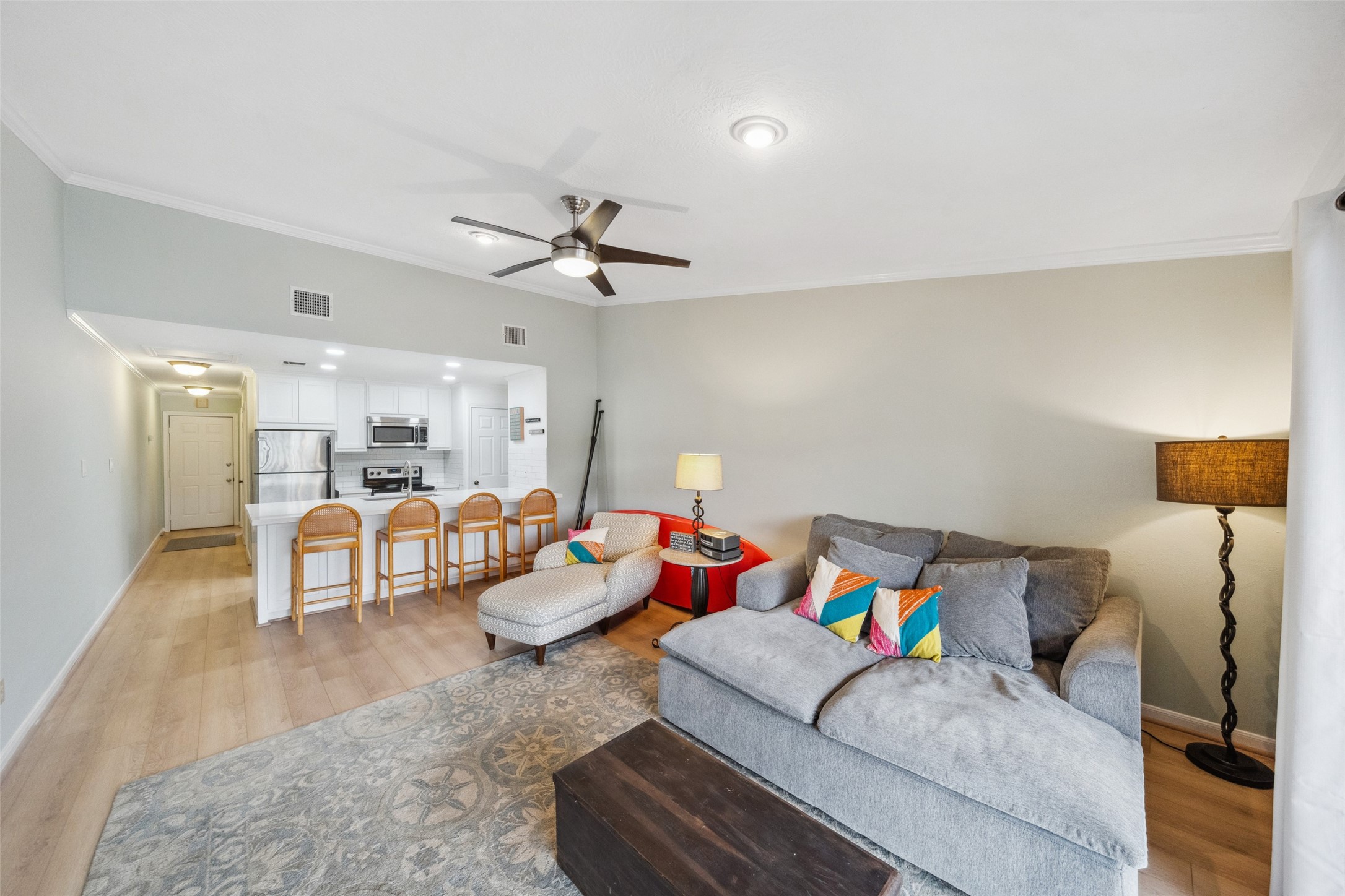801 River Road, Unit F120 Montgomery, TX 77356 - Photo 11 of 18 a living room with furniture and a wooden floor