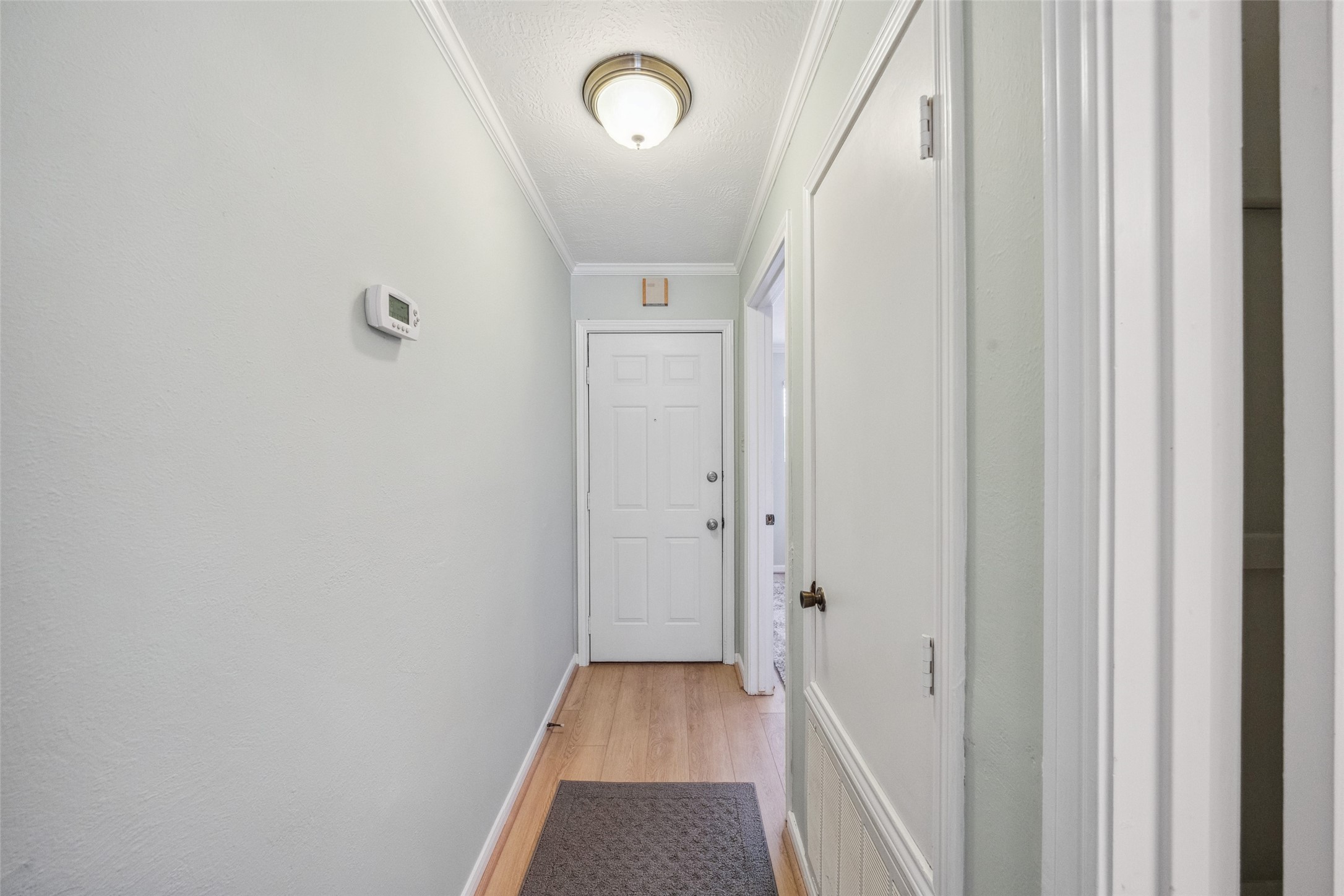 801 River Road, Unit F120 Montgomery, TX 77356 - Photo 13 of 18 a view of a hallway with wooden floor and staircase