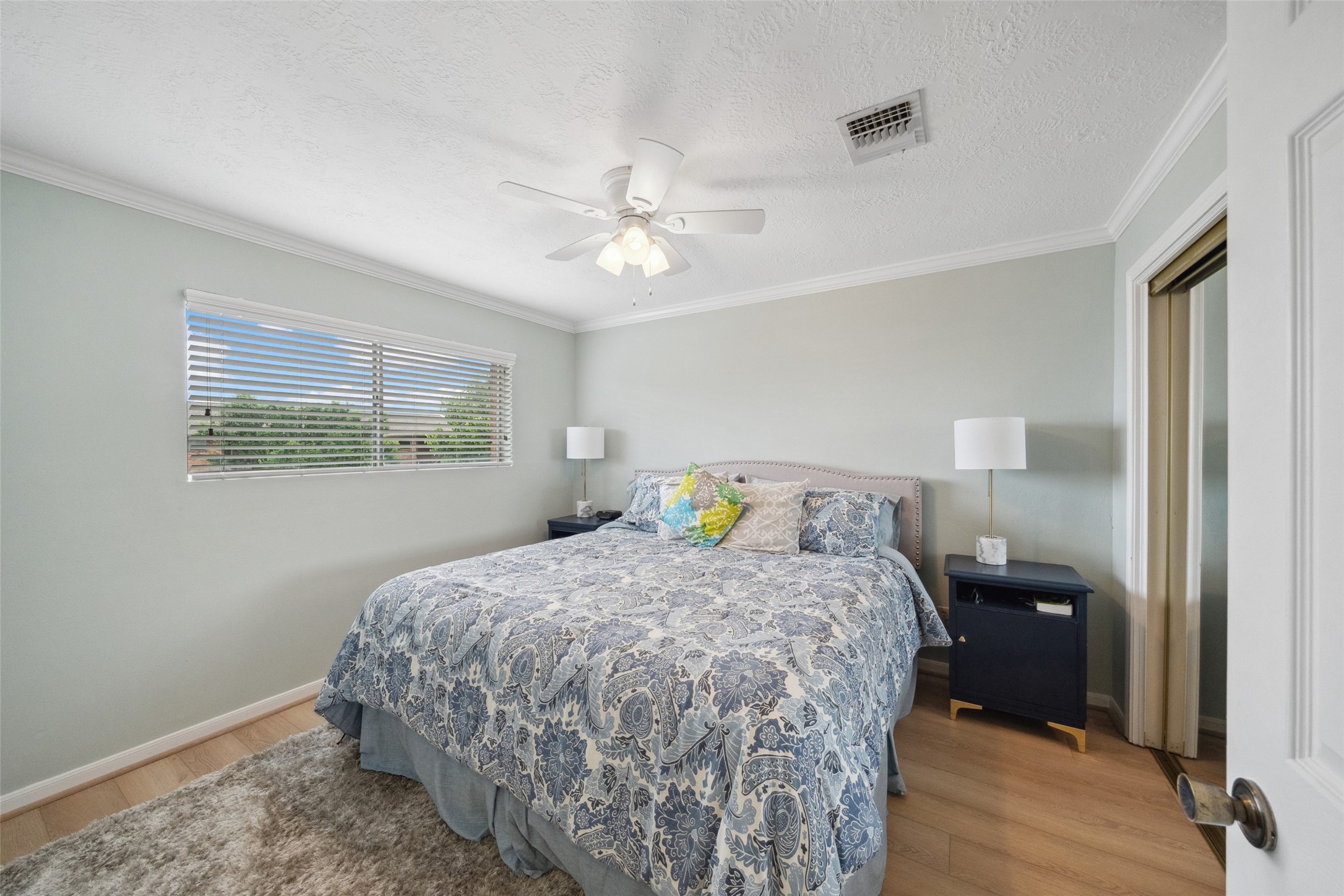 801 River Road, Unit F120 Montgomery, TX 77356 - Photo 16 of 18 a bedroom with a bed and a window