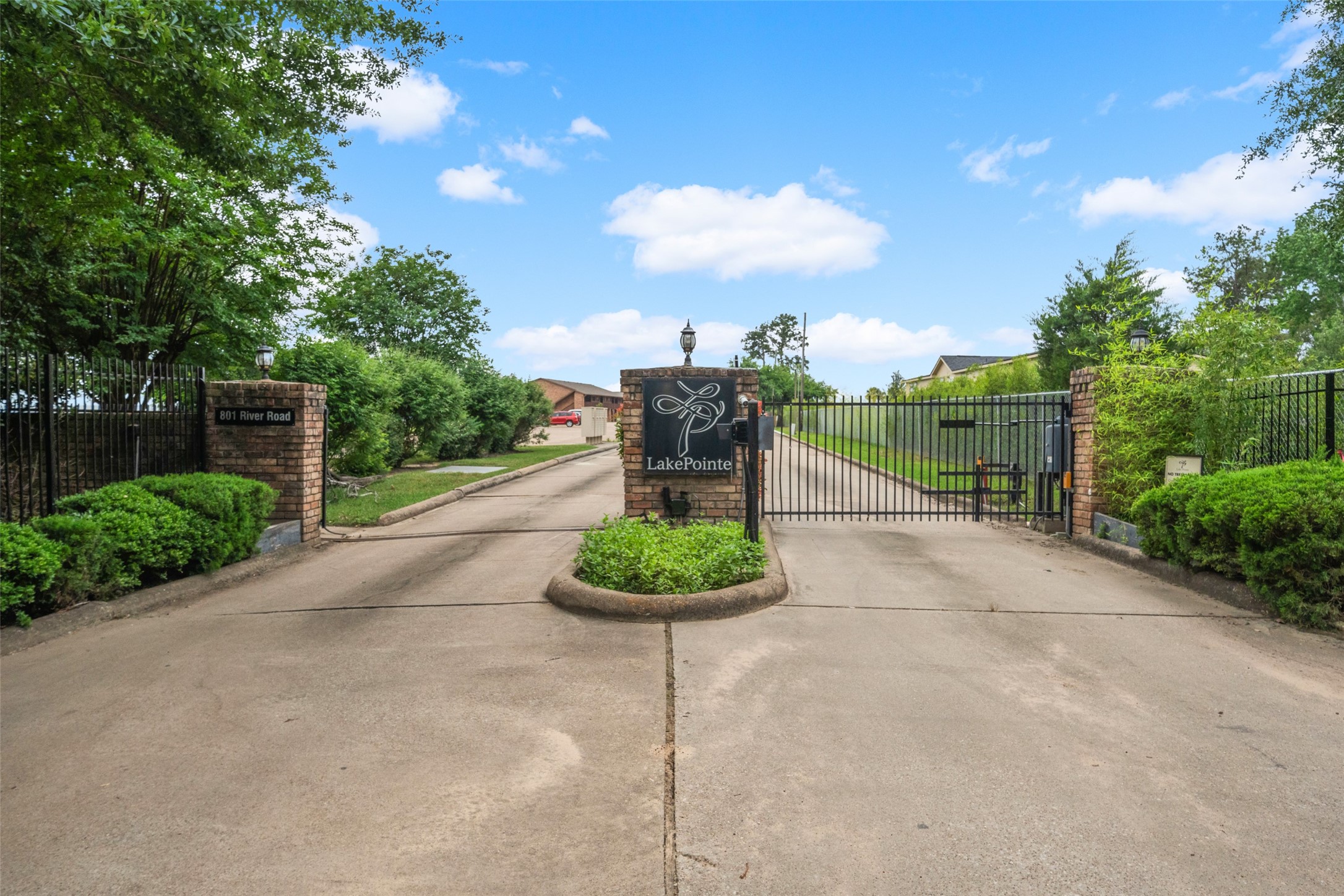 801 River Road, Unit F120 Montgomery, TX 77356 - Photo 18 of 18 a backyard of a house with a garden and barbeque oven