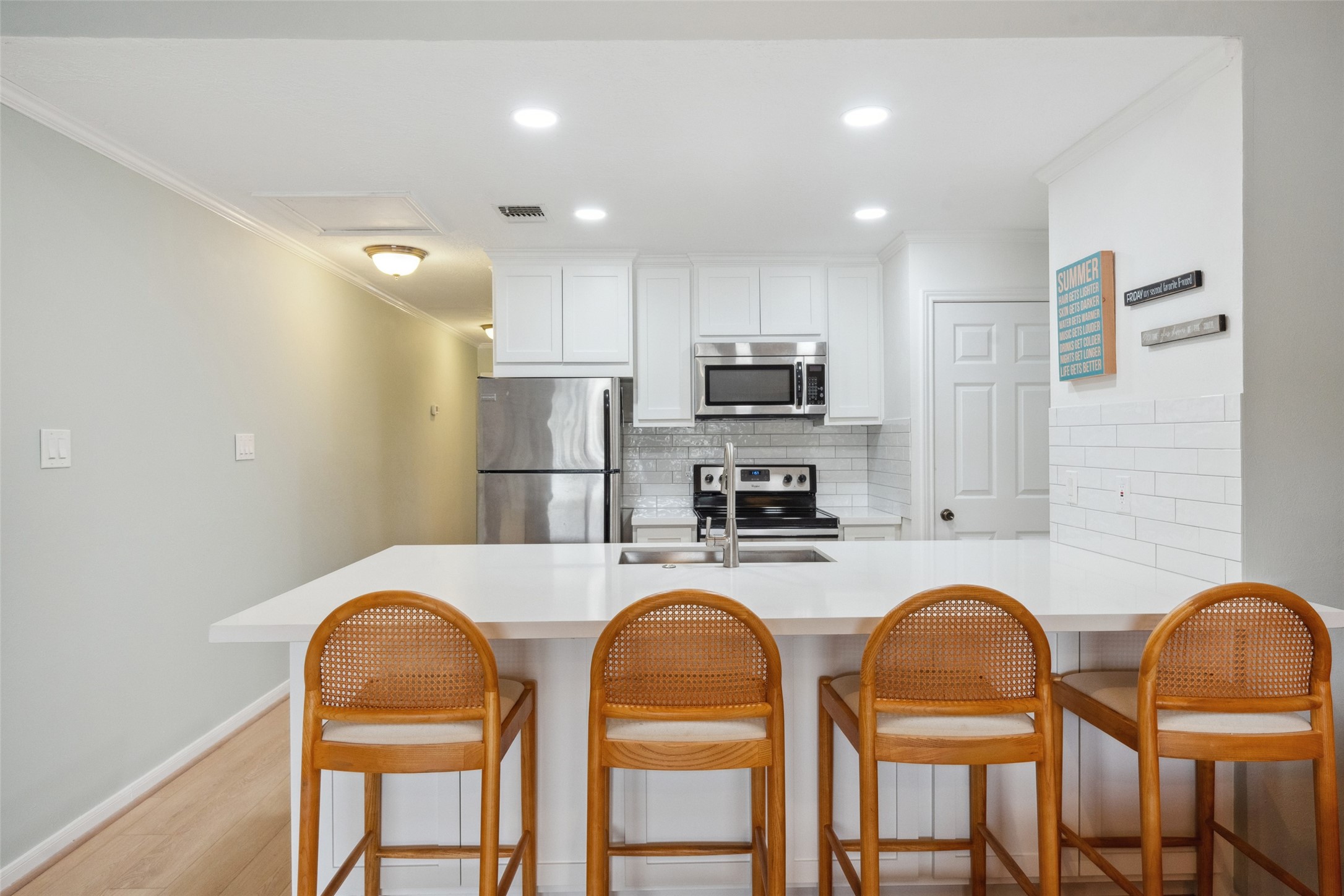 801 River Road, Unit F120 Montgomery, TX 77356 - Photo 10 of 18 a kitchen with stainless steel appliances granite countertop a dining table chairs refrigerator and microwave