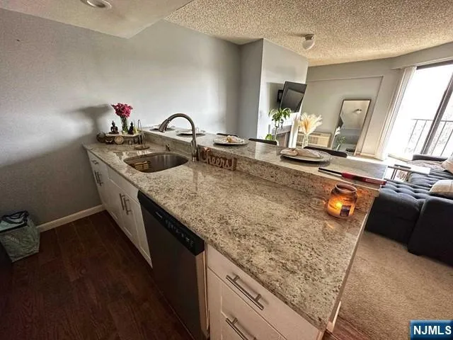 a kitchen with sink and stove