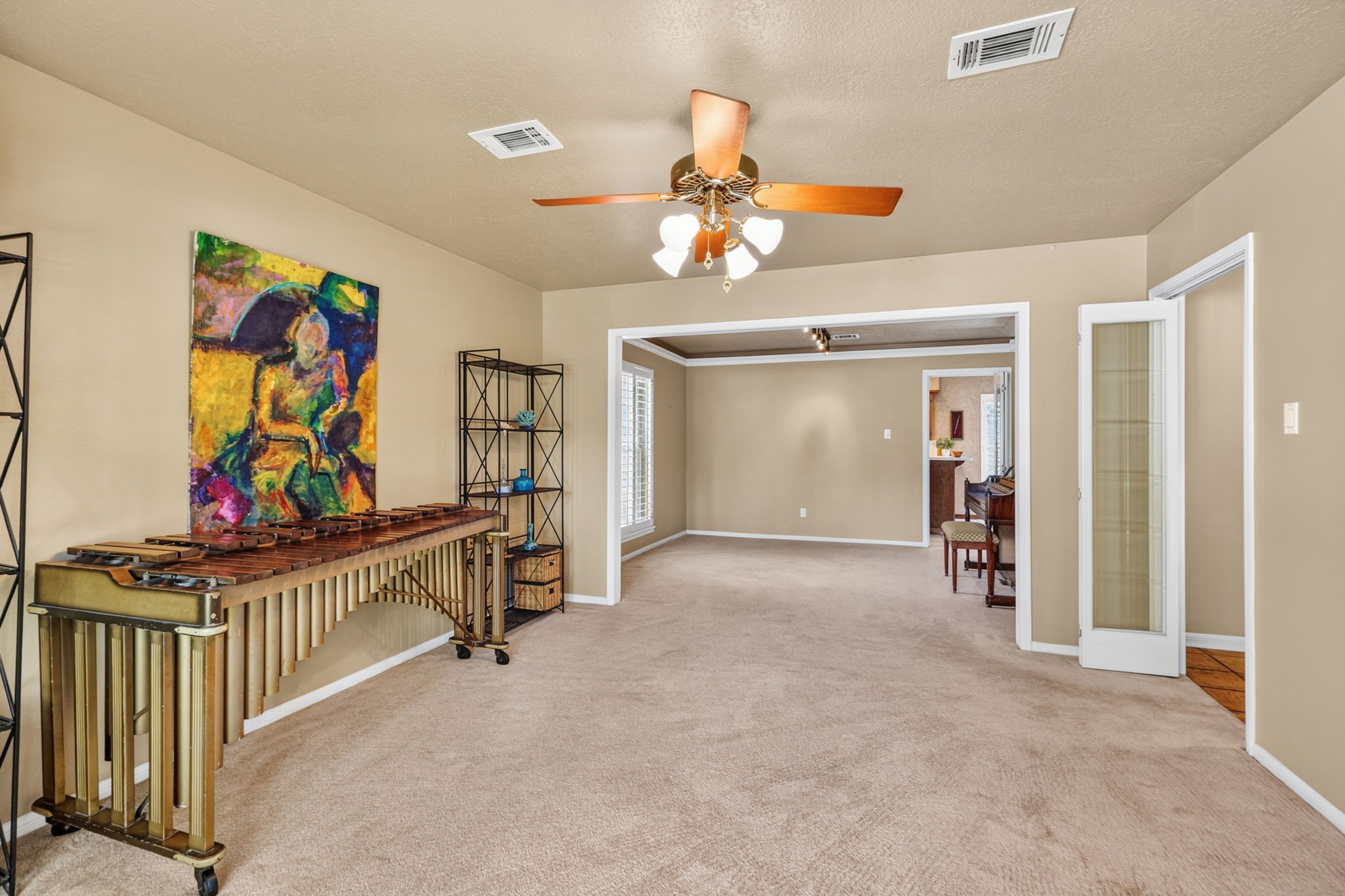 3414 Flaming Candle Drive Spring, TX 77388 - Photo 25 of 50 LIVING & DINING ROOMS - This view is from the bay window looking towards the kitchen. You can see folding doors on the right, which can be used to close off this room from the entry.