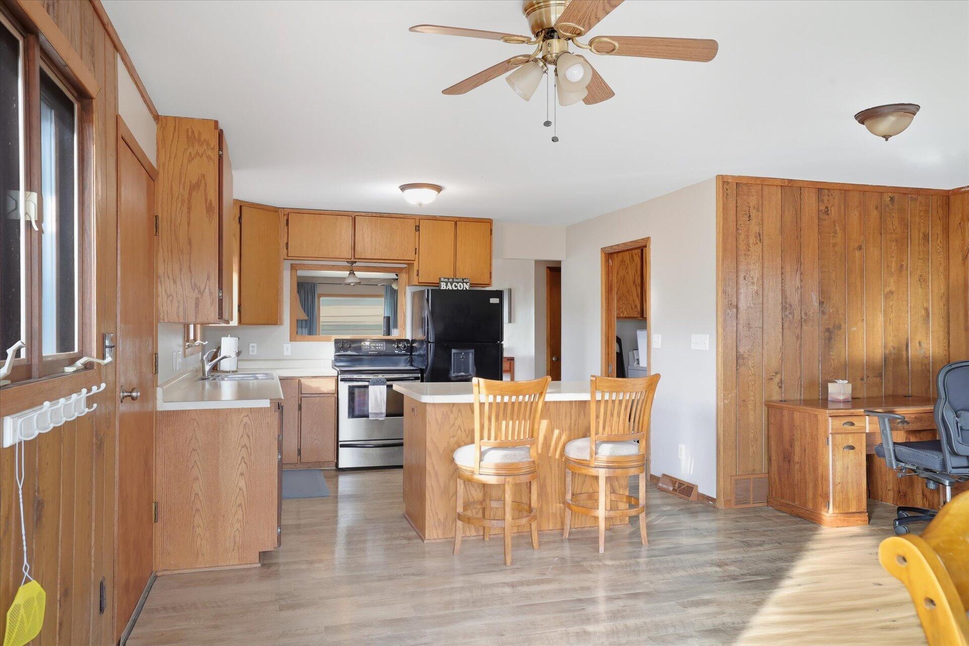 N8838 County Road East East Troy, WI 53120 - Photo 5 of 26 Kitchen with island and open concept