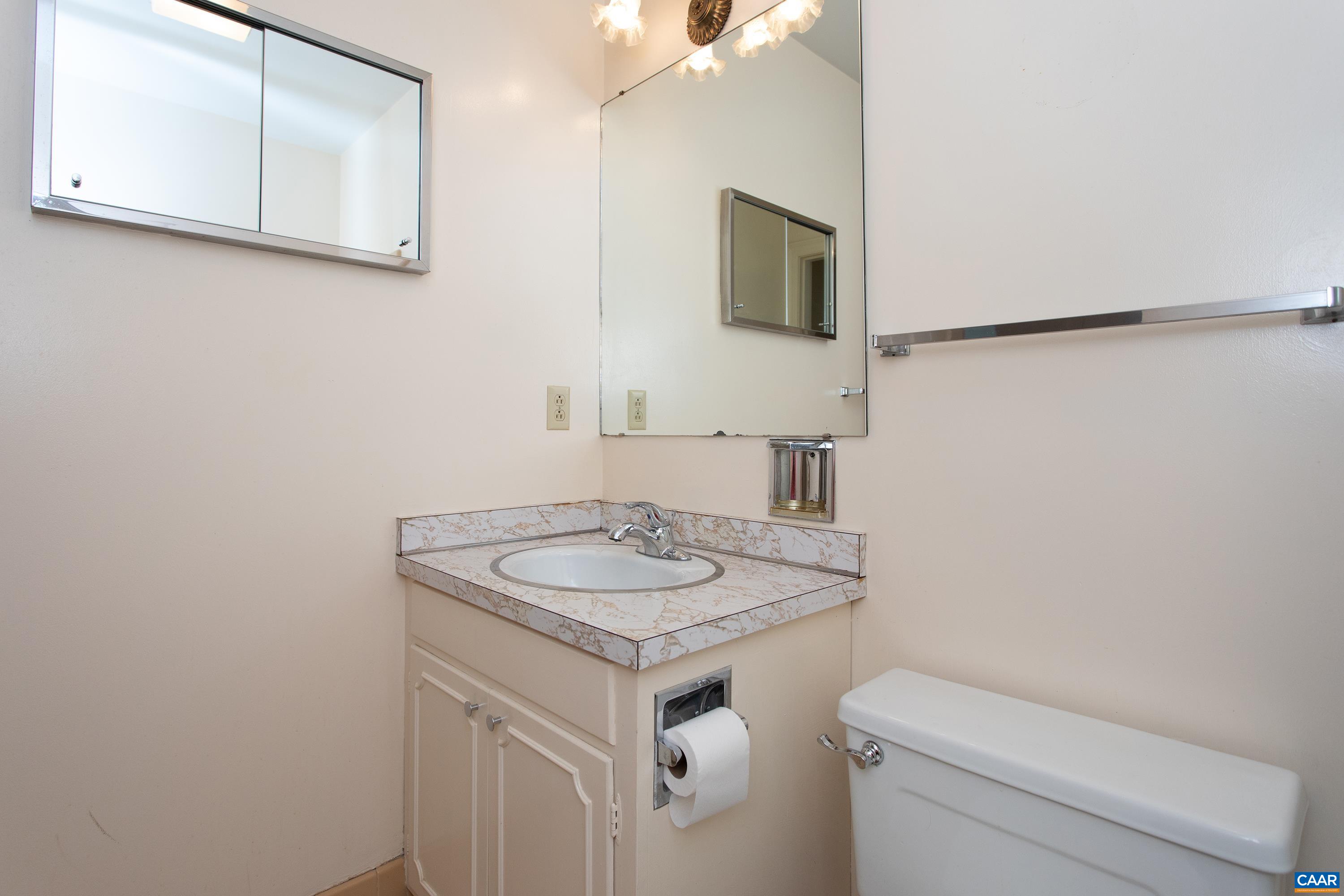 2617 Northfield Road Charlottesville, VA 22901 - Photo 33 of 68 a bathroom with a granite countertop sink and a mirror